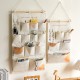 Multifunctional cotton and linen dormitory bedside storage bag, bedroom, and living room door storage bag. Multifunctional cotton and linen dormitory bedside storage bag, bedroom, and living room door storage bag.