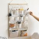 Multifunctional cotton and linen dormitory bedside storage bag, bedroom, and living room door storage bag. Multifunctional cotton and linen dormitory bedside storage bag, bedroom, and living room door storage bag.